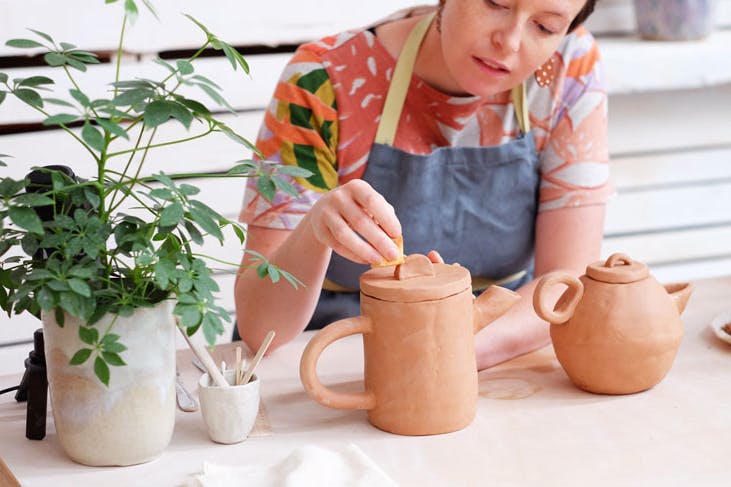A women teaching one of Clay Sydney's pottery classes.